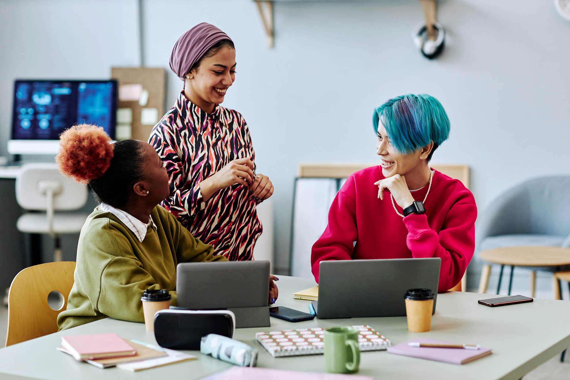 diverse team of creative young employees chatting about their recent diversity training